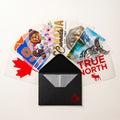 Canadian DTF sample pack transfers fanned out from a black envelope
